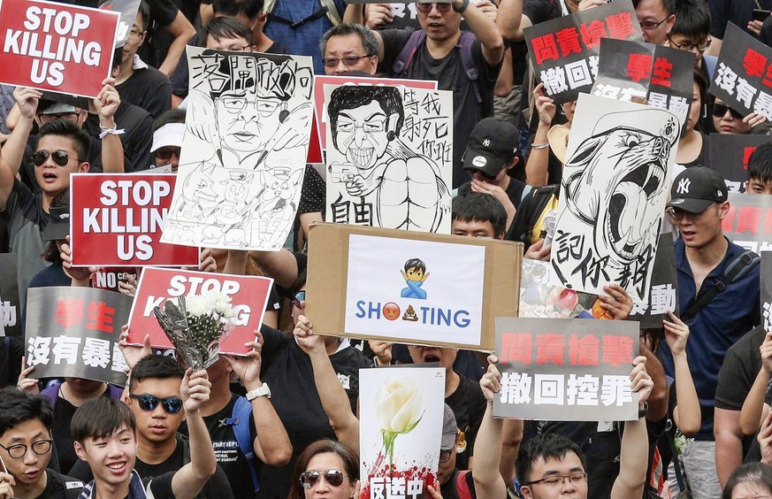 Hong Kong extradition bill protest Protesters march against a controversial extradition bill on a street in Hong Kong on June 16, 2019, demanding the total withdrawal of the bill that would allow the  ...