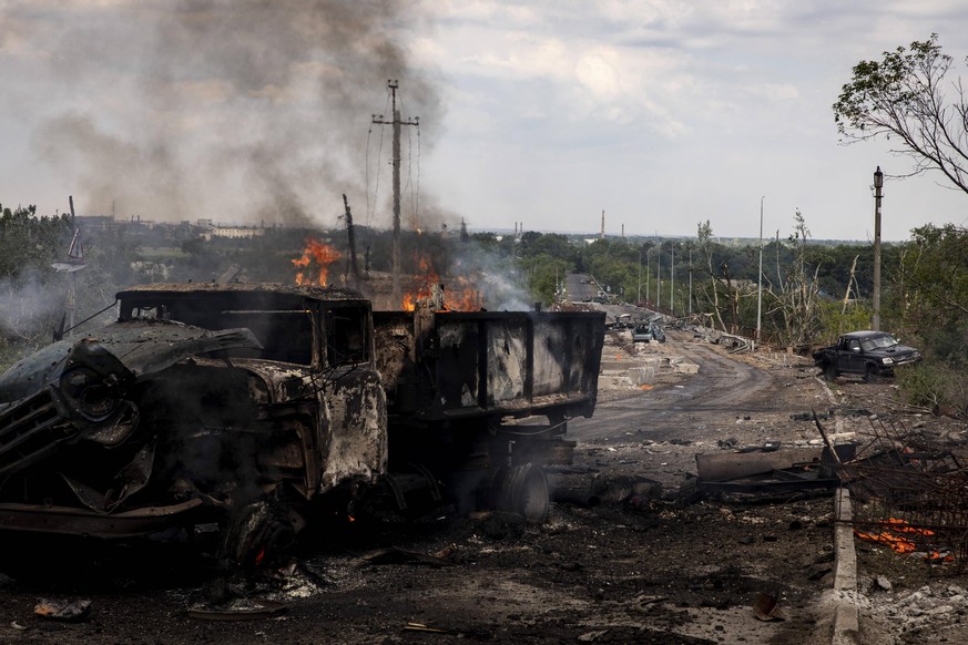 May 28, 2022, Lysychansk, Luhanska Oblast, Ukraine: A truck on fire can be seen on the bridge connecting Severodoonetsk and Lysychansk, Luhansk. As Russian troops launching the offensive from multiple ...
