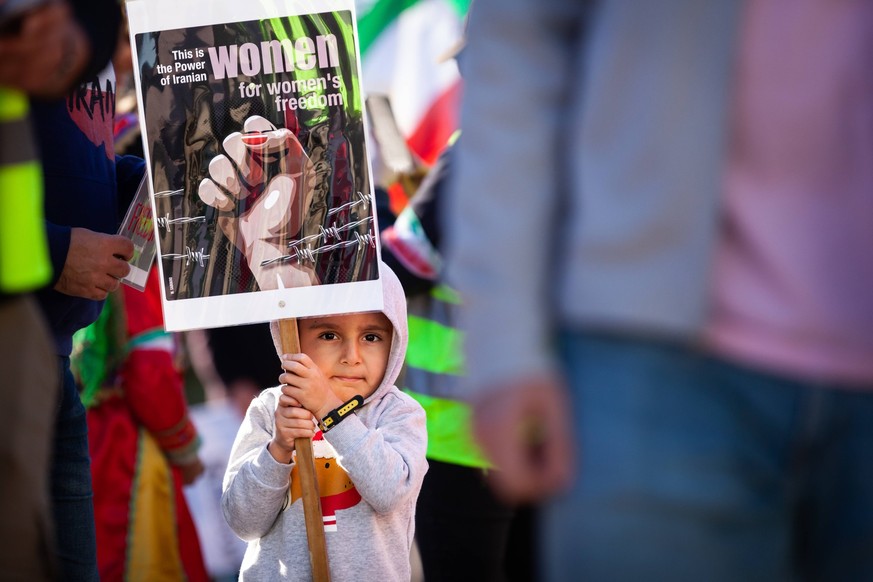 Iranian march in Washington, DC A young child attends a rally and march in support of protesters in Iran. Demonstrations erupted following the September 16, 2022, death of 22-year-old Mahsa Amini and  ...