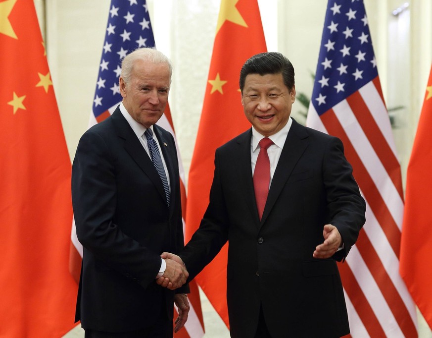 131204 -- BEIJING, Dec. 4, 2013 Xinhua -- Chinese President Xi Jinping R shakes hands with US Vice President Joe Biden during their meeting at the Great Hall of the People in Beijing, capital of China ...
