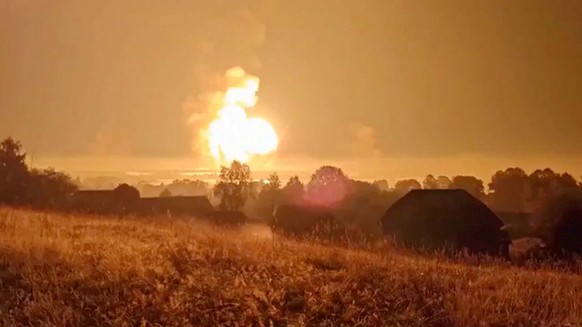 Flames rise during an explosion, amid the Russia-Ukraine conflict, in Toropets, Tver region, Russia in this screen grab obtained from a social media video released on September 18, 2024. Social Media/ ...