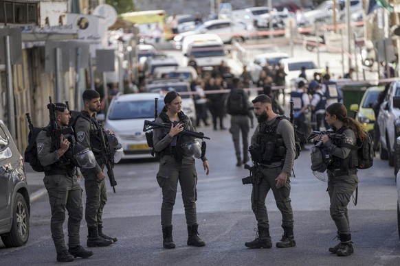Israeli police inspect the scene of a stabbing attack in east Jerusalem, Monday, Nov. 6, 2023. A 16-year-old Palestinian stabbed two Israeli border police officers near a police station in east Jerusa ...