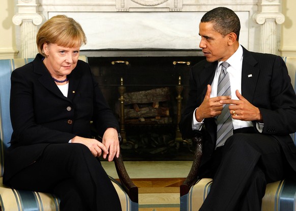 WASHINGTON - NOVEMBER 03: U.S. President Barack Obama (R) meets with German Chancellor Angela Merkel (L) in the Oval Office at the White House November 3, 2009 in Washington, DC. Merkel will address a ...