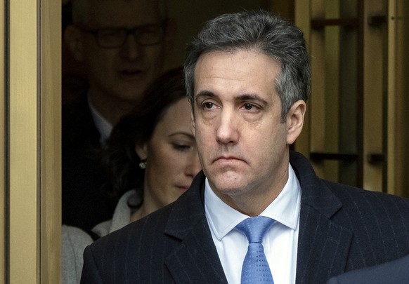 FILE- In this Dec. 12, 2018 file photo, President Donald Trump's former lawyer, Michael Cohen, leaves federal court in New York after being sentenced to three years in prison. Cohen was furloughed fro ...