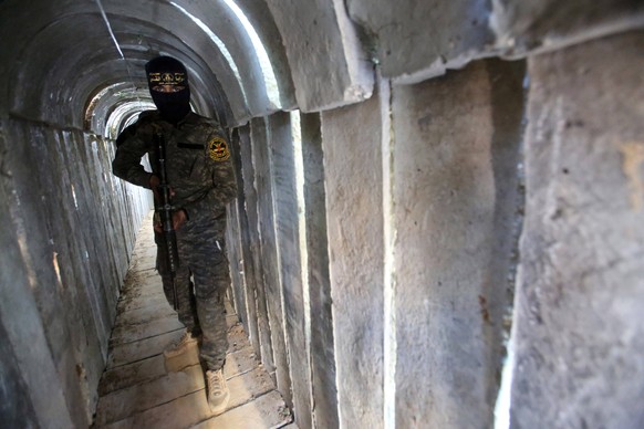 May 18, 2022, Beit Hanoun, Gaza Strip, Palestinian Territory: A member of Saraya al-Quds, the military wing of the Islamic Jihad movement takes a position inside a military tunnel marking the first an ...