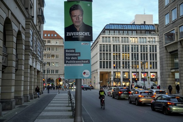 An election poster of Green Party top candidate, federal minister for economy Robert Habeck on display prior to the upcoming German federal Bundestag elections, in Berlin, Germany, Monday, Jan. 13, 20 ...