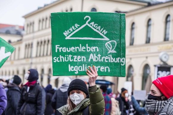 March 20, 2021, Munich, Bavaria, Germany: Pro Choice demonstrators standing against the Munich March for Life demonstration organized by radical Christian groups and associated with Querdenken. The Ma ...