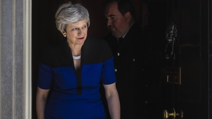 May 14, 2019 - London, London, UK - London, UK. Prime Minister Theresa May leaves 10 Downing Street to greet NATO Secretary General Jens Stoltenberg, ahead of a bilateral meeting. London UK PUBLICATIO ...