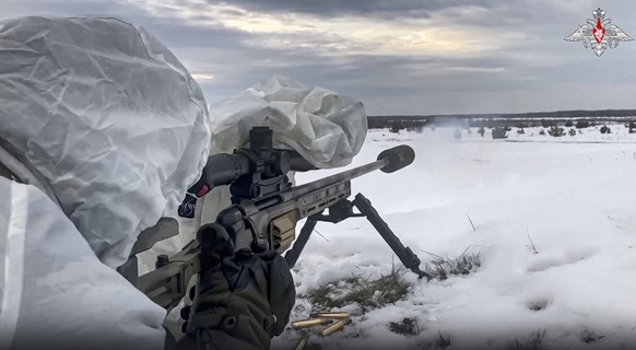 In this handout photo taken from video released by Russian Defense Ministry Press Service on Wednesday, Dec. 28, 2022, a Russian soldier takes part in drills at an unspecified location in Belarus. (Ru ...