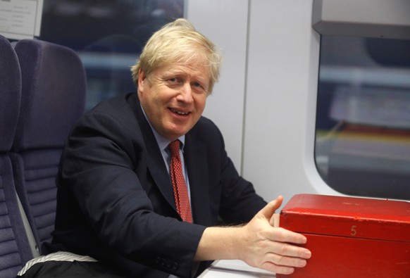 Britain s Prime Minister Boris Johnson enroutes to Kent aboard a train Britain s Prime Minister Boris Johnson enroutes to Kent aboard a train, Britain December 6, 2019. REUTERS/Peter Nicholls/Pool PUB ...