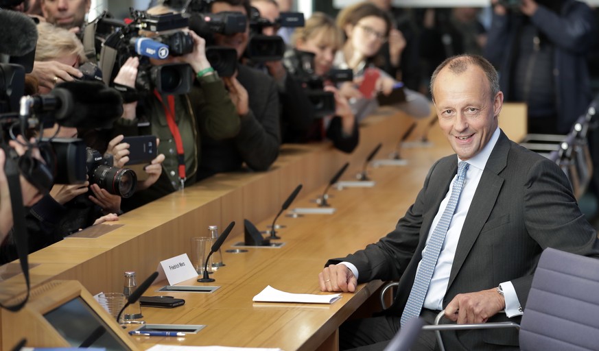 Friedrich Merz, right, member of the German Christian Democratic Party, arrives for a press conference in Berlin, Germany, Wednesday, Oct. 31, 2018. Friedrich Merz, 62, is one of three high-profile ca ...