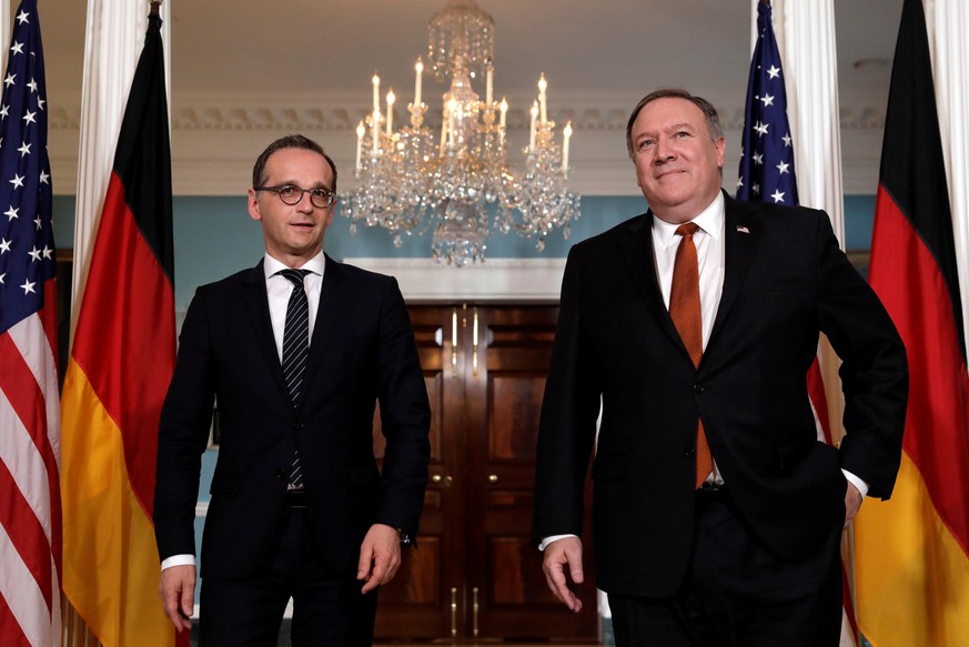 U.S. Secretary of State Mike Pompeo (R) and German Foreign Minister Heiko Maas face reporters before their meeting at the State Department in Washington, U.S., May 23, 2018. REUTERS/Yuri Gripas
