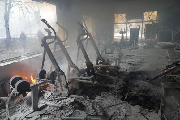 A view of smoke from inside a damaged gym following shelling in Kyiv, Ukraine, Wednesday, March 2, 2022. Russian forces have escalated their attacks on crowded cities in what Ukraine's leader called a ...