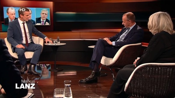 Moderator Markus Lanz (l.) provoziert Friedrich Merz (m.).