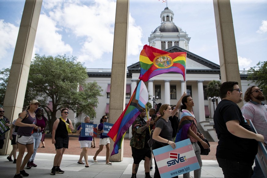 An estimated 200 people marched from Westcott Fountain to the Florida Capitol, Friday, March 31, 2023, in Tallahassee, Fla., to express their opposition to HB 1069, an expansion on the &quot;Don&#039; ...