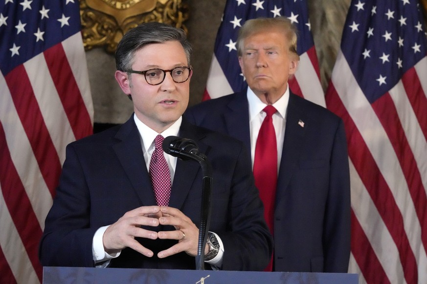 Speaker of the House Mike Johnson, R-La., speaks as Republican presidential candidate former President Donald Trump listens during a news conference, Friday, April 12, 2024, at Mar-a-Lago in Palm Beac ...