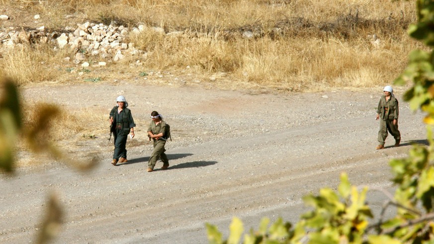 FILE - in this Saturday, Oct. 27, 2007 file photo, members of the Kurdistan Workers&#039; party, known by its Kurdish acronym PKK, are seen near the Iraqi-Turkish border, northern Iraq. A Kurdish rebe ...