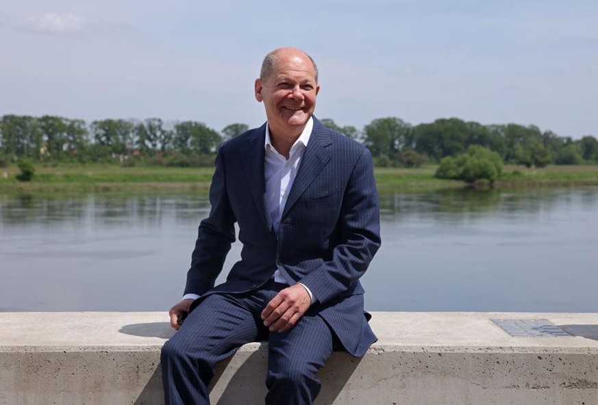 SCHOENEBECK, GERMANY - JUNE 01: Olaf Scholz, German finance minister and chancellor candidate of the German Social Democrats (SPD), sits on the bank of the Elbe River while attending a Saxony-Anhalt s ...
