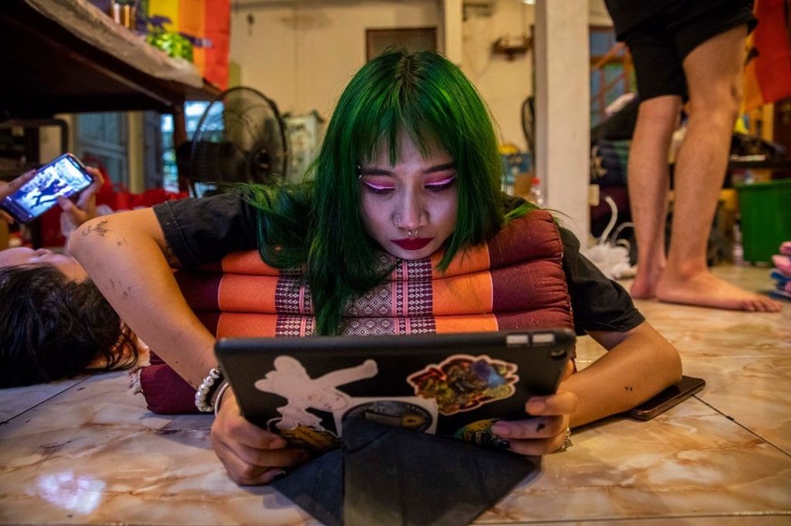 BANGKOK, THAILAND - OCTOBER 08: Tonor, a teenage member of the Feminist Liberation Front, handles the social media for the grouop on October 8, 2021 in Bangkok, Thailand. The Feminist&#039;s Liberatio ...