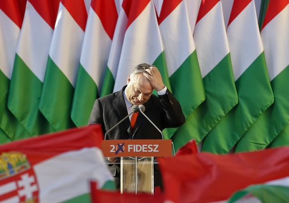 Prime Minister Viktor Orban's pauses while delivering a speech during the final electoral rally of his Fidesz party in Szekesfehervar, Hungary, Friday, April 6, 2018. Hungarians will vote Sunday in pa ...