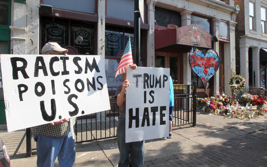 Trump protesters show their feeling for the president outside the doors of Ned Peppers bar, the site of a mass shooting, Wednesday, August 7, 2019 in Dayton, Ohio. Photo by John Sommers II/UPI Photo v ...