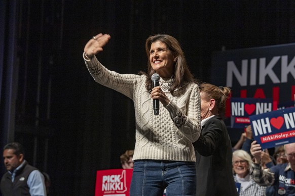 Former South Carolina Governor and Republican presidential candidate Nikki Haley greets the crowd after US television personality Judge Judy Sheindlin introduces her during a campaign event in Exeter, ...