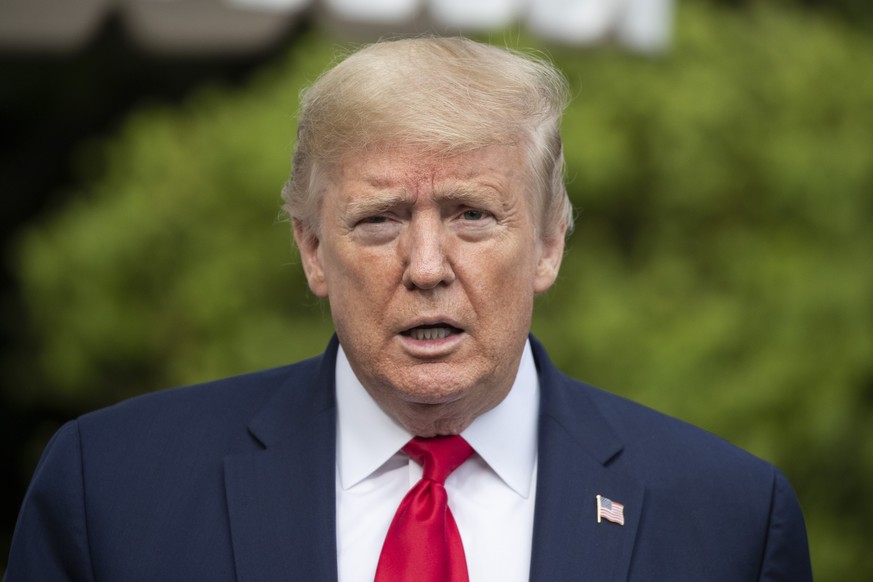 President Donald Trump speaks with reporters as he departs the White House, Friday, May 1, 2020, in Washington. Trump is en route to Camp David, Md.(AP Photo/Alex Brandon)