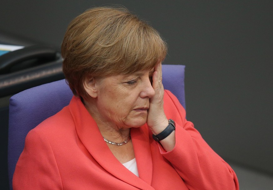 BERLIN, GERMANY - JULY 17: German Chancellor Angela Merkel attends debates prior to a vote over the third EU financial aid package to Greece at an extraordinary session of the German parliament, the B ...