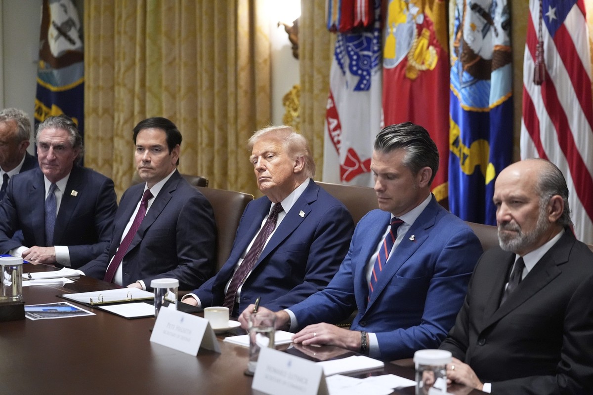 President Donald Trump listens during a cabinet meeting. Tuesday, Aug. 26, 2025, at the White House in Washington, with from left, Secretary of Interior Doug Burgum, Secretary of State Marco Rubio, Tr ...