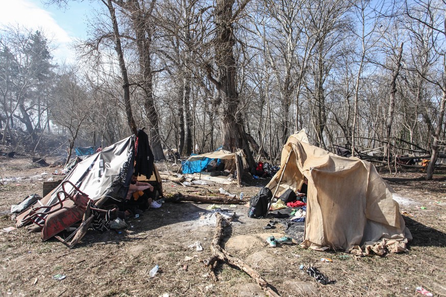 Refugees wait in front of the Greek border at Pazarkule gate, in Edirne, Turkey, 3 March 2020. Turkey will no longer stop Syrian irregular migrants from reaching Europe, a senior Turkish official said ...