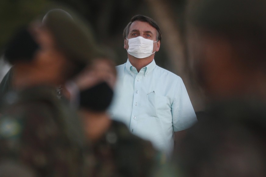 200723 -- BRASILIA, July 23, 2020 -- Brazil s President Jair Bolsonaro attends the flag-raising ceremony at his official residence in Brasilia, Brazil, July 22, 2020. Brazil s President Jair Bolsonaro ...