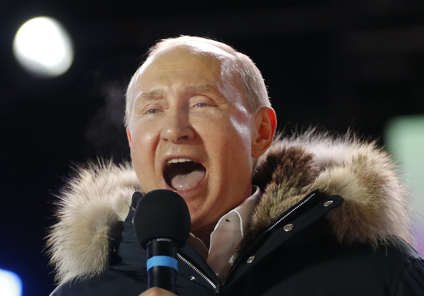 In this March 18, 2018 photo, Russian President Vladimir Putin speaks to supporters during a rally near the Kremlin in Moscow. The tempest over President Donald Trump's congratulatory phone call to Ru ...