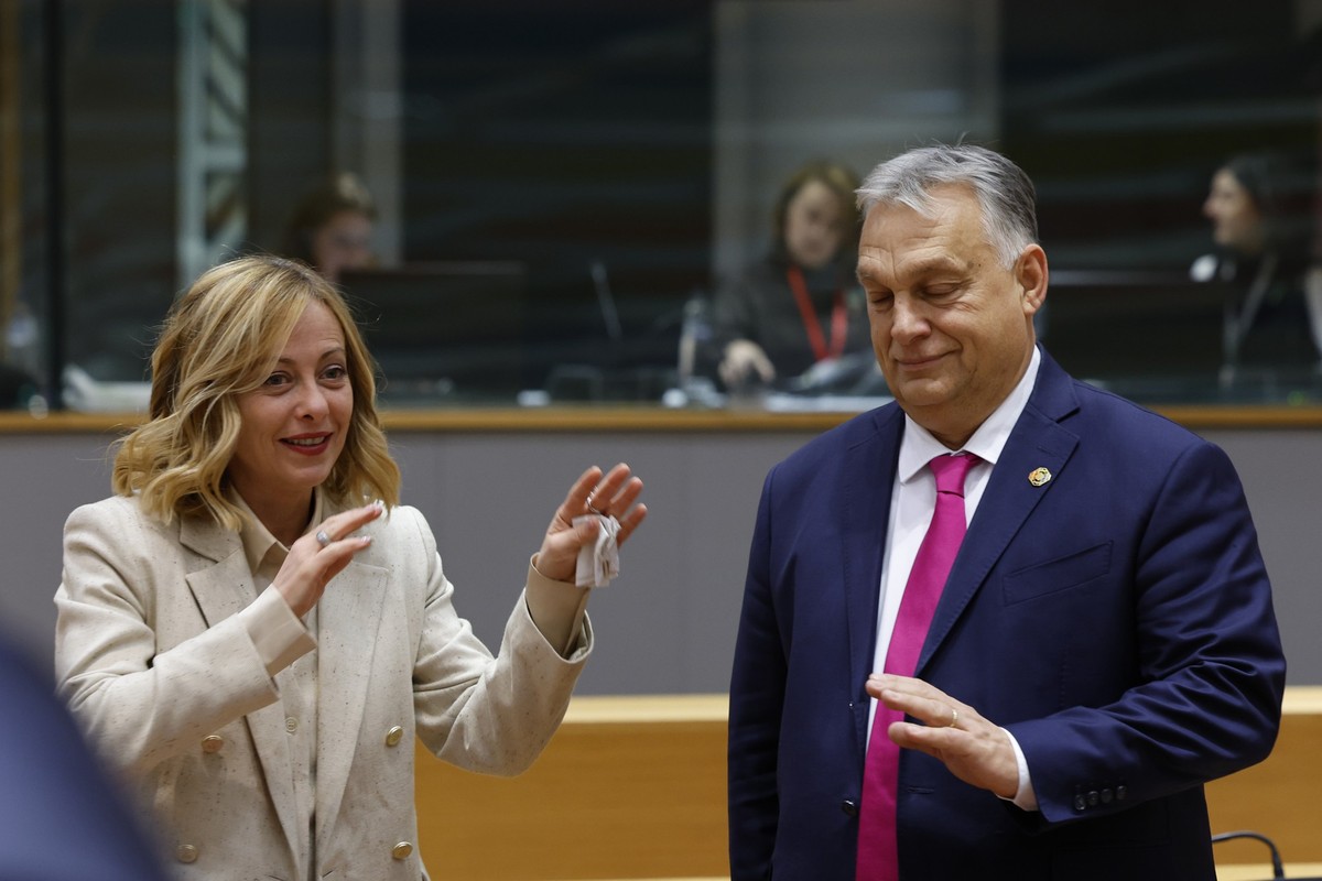 Hungary&#039;s Prime Minister Viktor Orban, right, speaks with Italy&#039;s Prime Minister Giorgia Meloni during a round table meeting at an EU-Western Balkans summit in Brussels, Wednesday, Dec. 18,  ...
