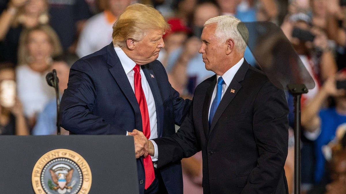 July 17, 2019, Greenville, NC, USA: Vice President Mike Pence shakes hands with President Donald Trump after introducing him during a campaign rally Wednesday, July 17, 2019 at East Carolina Universit ...