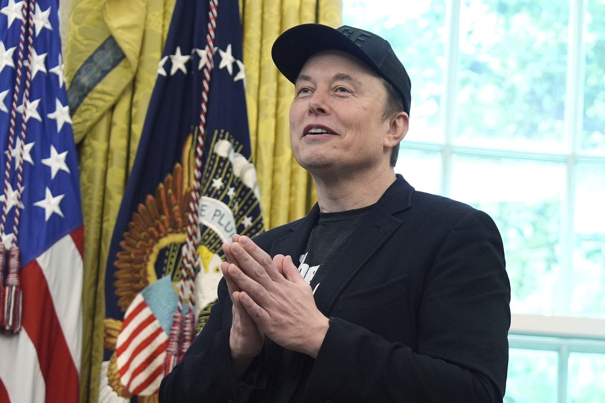 Elon Musk gestures as he speaks during a news conference with President Donald Trump in the Oval Office of the White House, Friday, May 30, 2025, in Washington. (AP Photo/Evan Vucci)