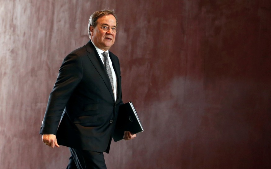 North Rhine Westphalia State Premier Armin Laschet arrives for a meeting with federal state leaders at the Chancellery in Berlin, Germany March 12, 2020. REUTERS/Michele Tantussi