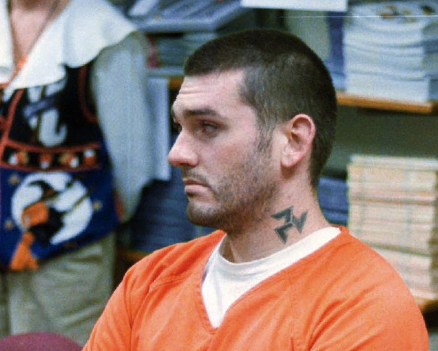 FILE - In this Oct. 31 1997, file photo, Daniel Lewis Lee waits for his arraignment hearing for murder in the Pope County Detention Center in Russellville, Ark. On Tuesday, July 7, 2020, family member ...