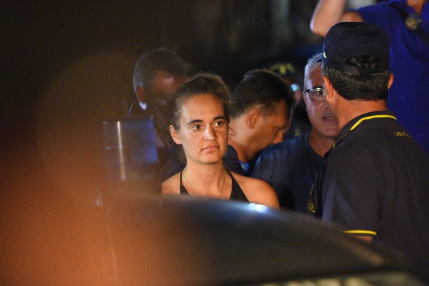 Captain of Sea Watch 3 rescue ship Carola Rackete is taken away by the Finance Guard Lampedusa,ITALY-29-06-2019 |