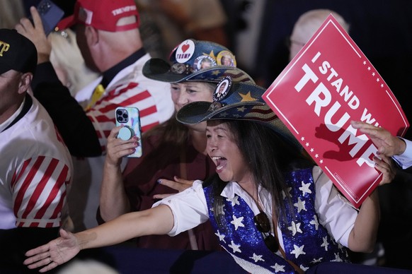 A supporter reacts after former President Donald Trump spoke at his Mar-a-Lago estate hours after being arraigned in New York City, Tuesday, April 4, 2023, in Palm Beach, Fla. (AP Photo/Rebecca Blackw ...
