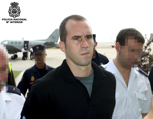 A handout provided by the Spanish Interior Ministry that shows Garikoitz Aspiazu (C), alias &#039;Txeroki&#039; - the alleged Basque terrorist group ETA leader who ordered an end to the latest truce - ...