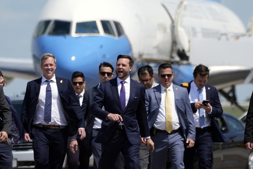 Republican vice presidential nominee Sen. JD Vance, R-Ohio, walks back from looking at Air Force Two at Chippewa Valley Regional Airport, Wednesday, Aug. 7, 2024, in Eau Claire, Wis. (AP Photo/Alex Br ...