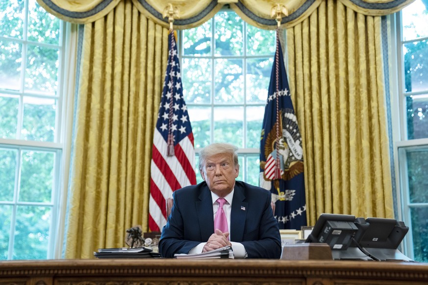 President Donald Trump listens during a meeting with Senate Majority Leader Mitch McConnell of Ky., and House Minority Leader Kevin McCarthy of Calif., in the Oval Office of the White House, Monday, J ...
