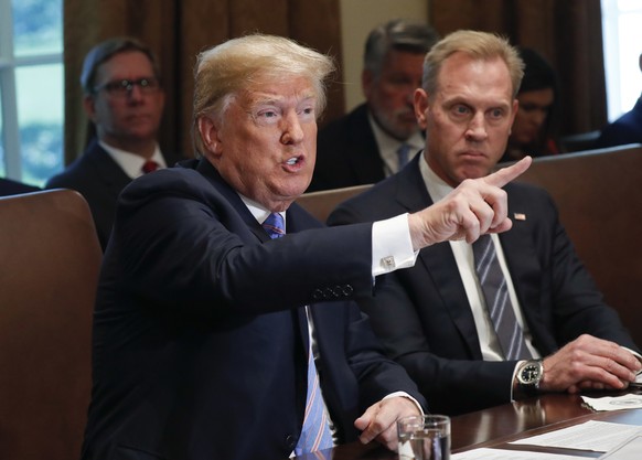 President Donald Trump gestures while speaking during his meeting with members of his cabinet in Cabinet Room of the White House in Washington, Wednesday, July 18, 2018. Looking on is Deputy Secretary ...