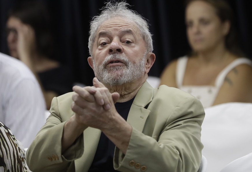 Former Brazilian President Luiz Inacio Lula da Silva gestures to supporters during the launch of his book, in Sao Paulo, Brazil, Friday, March 16, 2018. In his book entitled &quot;Truth Will Triumph:  ...