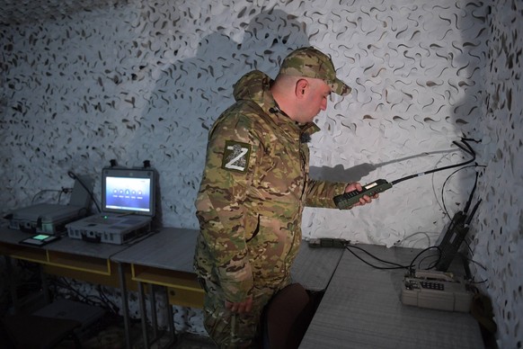 Russia Ukraine Military Operation Signalmen 8539411 17.10.2023 A serviceman of Russian Signal corps holds an Azart radio station in the course of Russia s military operation in Ukraine, at the unknown ...