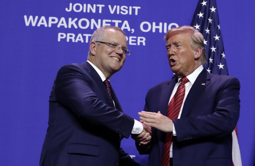 President Donald Trump and Australian Prime Minister Scott Morrison shake hands at Pratt Industries, Sunday, Sept 22, 2019, in Wapakoneta, Ohio. (AP Photo/Evan Vucci)