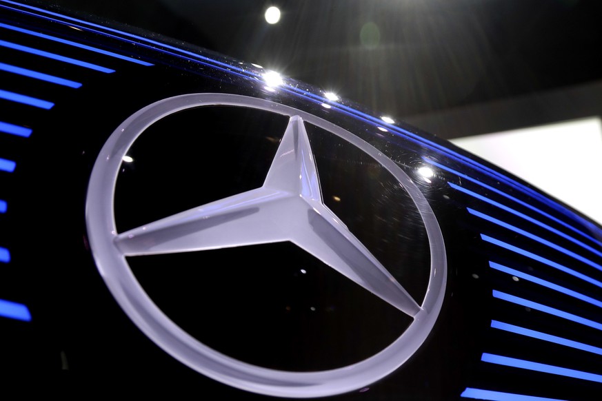 FILE- In this Feb. 2, 2017 file photo, the logo of Mercedes is photographed at the annual news conference at the company&#039;s headquarters in Stuttgart, Germany. Daimler AG says it has fired an exec ...