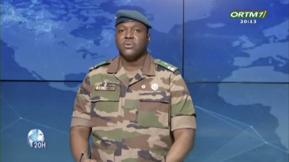 In this image made from video, Col. Abdoulaye Maiga, Mali&#039;s state minister for Territorial Administration and Decentralisation, speaks on state television network ORTM on July 31, 2023 in Bamako, ...