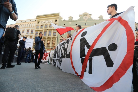 Polish region might lose EU funding due to anti-LGBT laws Photo: Jan Graczynski/East News Right-wing protesters attend a demonstration against the Pride Parade on May 18, 2019 in Krakow, Poland. The a ...
