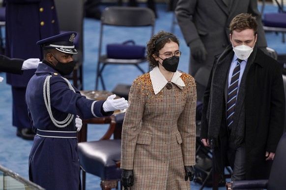 Washington, DC - January 20: EllaC and Cole EmhoffR, the son and daughter of Vice President Kamala Harris husband Doug Emhoff, are directed to their seats during the 59th presidential inauguration in  ...